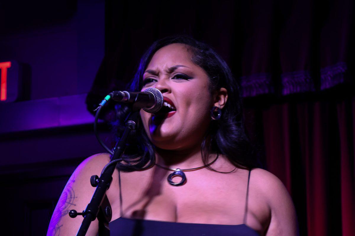 Spice, half of the musical duo Uncle Roy & Spice, sings to an intimate audience at the Cactus Cafe on Feb. 14. Max Kinser/TSTV News