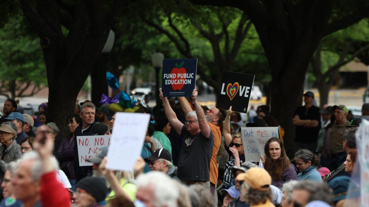 Protesters hold up signs advocating for increased public school funding during the Save Texas Schools Rally at the Texas Capitol Saturday. Justin Doud/TSTV News