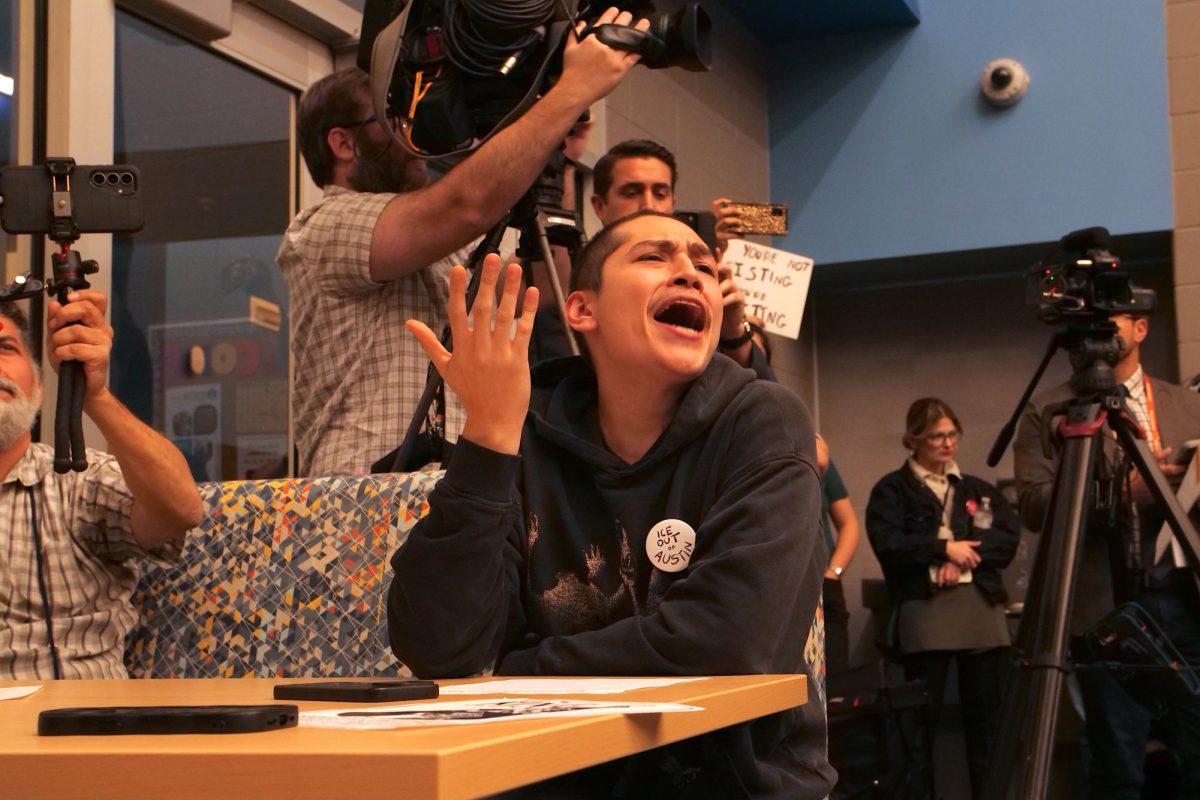 An attendee shouts during a town hall held at Govalle Elementary School in Austin, Texas, Feb. 5th, 2025.